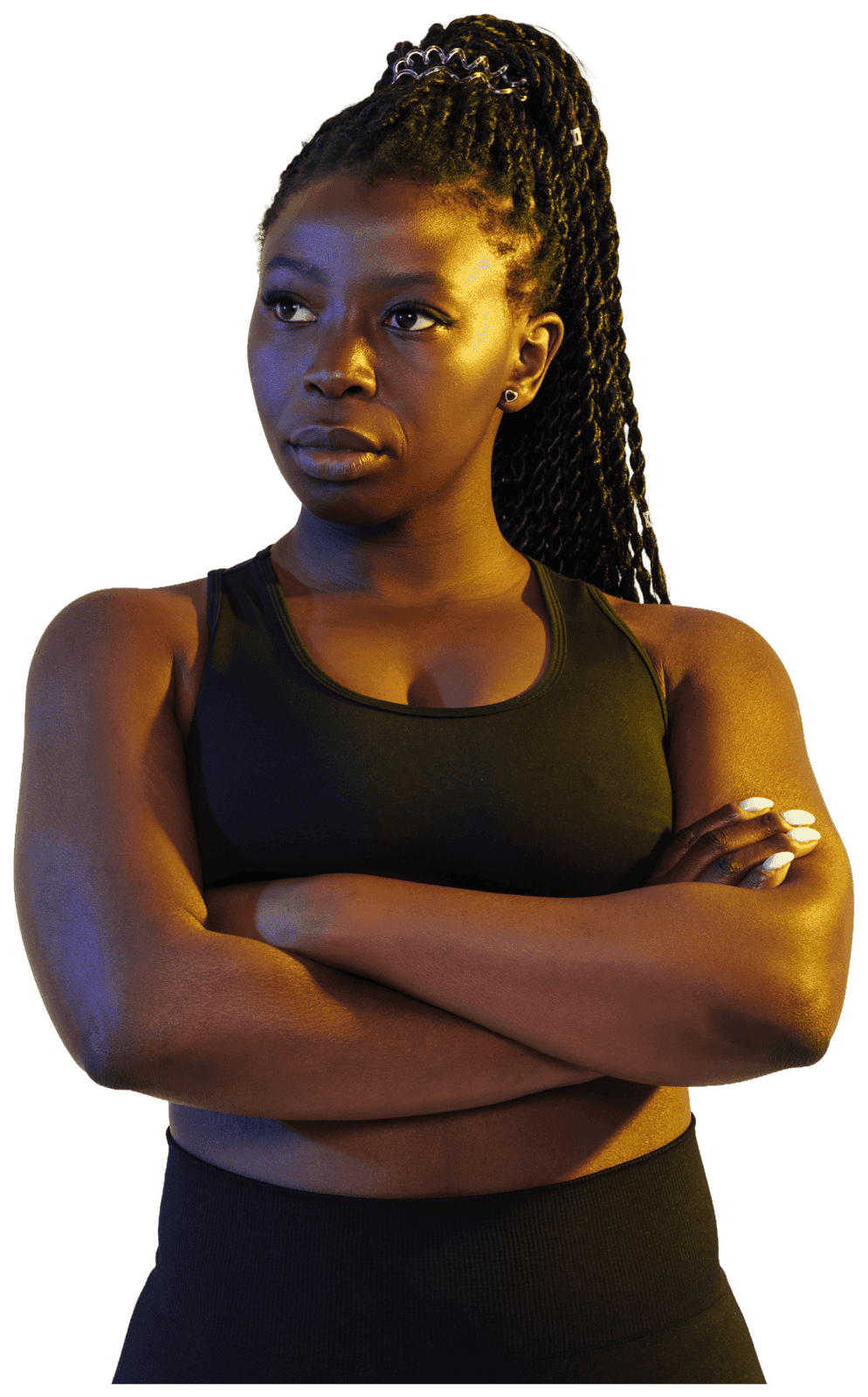 Black creator with a braided ponytail, arms crossed under dramatic gel lighting