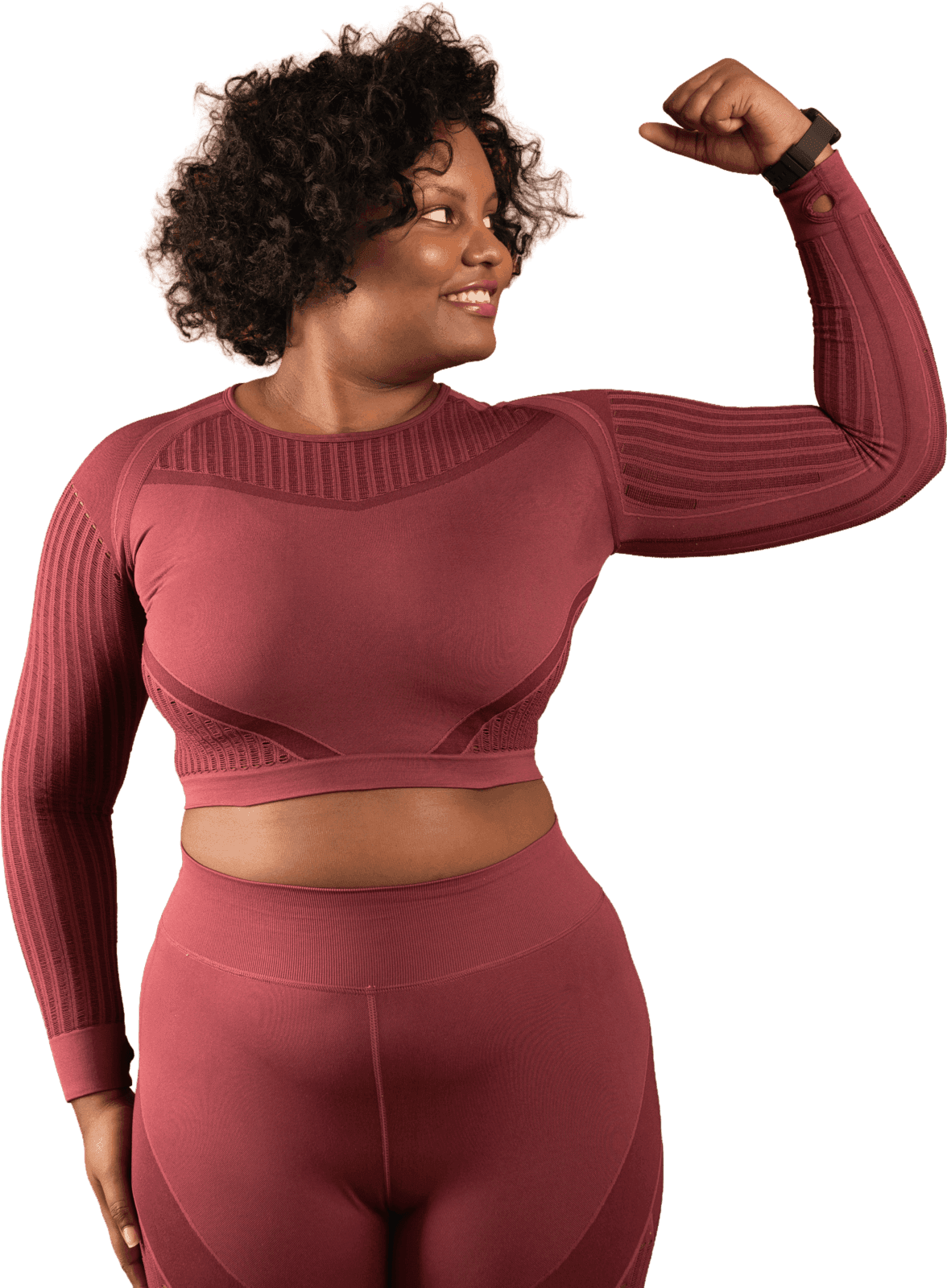 Black creator in activewear, flexing an arm